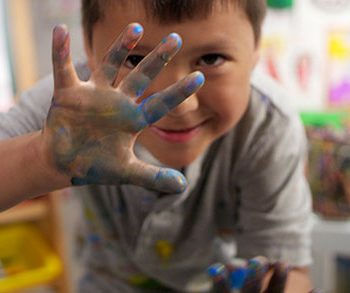 Child with paint on fingers