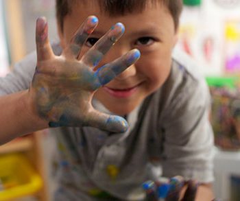 Child with paint on fingers